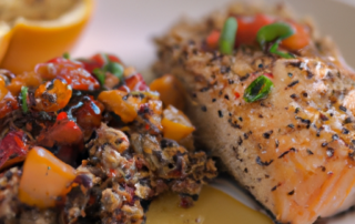Baked salmon with a honey mustard glaze served with roasted vegetables and quinoa.