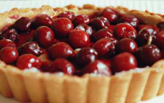 Cherry Almond Tart - a buttery almond crust filled with a layer of cherry jam and topped with fresh cherries.