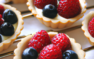 Berry Tartlets: Mini tartlets with a buttery crust, filled with a sweet vanilla cream and topped with fresh berries.
