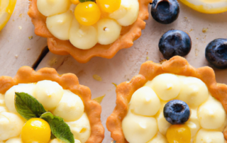 Lemon Curd Tartlets bite-sized tartlets filled with a tangy lemon curd made from fresh lemon juice and zest, topped with whipped cream and fresh berries.