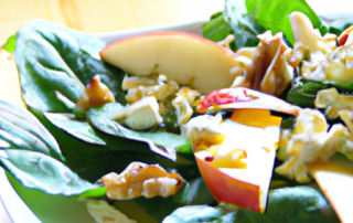 Apple and spinach salad with walnuts, feta cheese, and a honey mustard dressing.