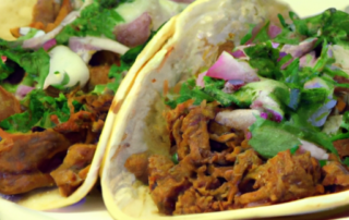Pork Carnitas Tacos - Slow-cook pork shoulder with a blend of spices until tender, then shred and serve in warm tortillas with your favorite toppings like diced onions, cilantro, and salsa.